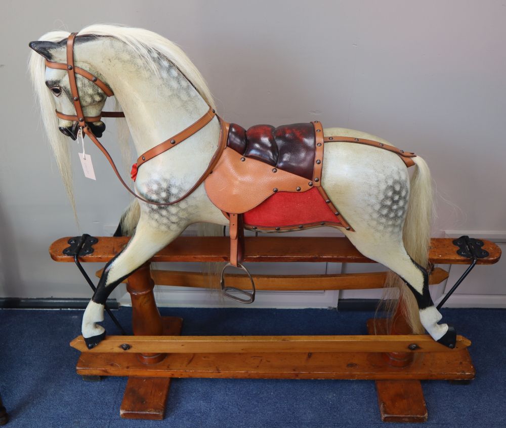 An F.H. Ayres dapple grey rocking horse, L.128cm, H.114cm